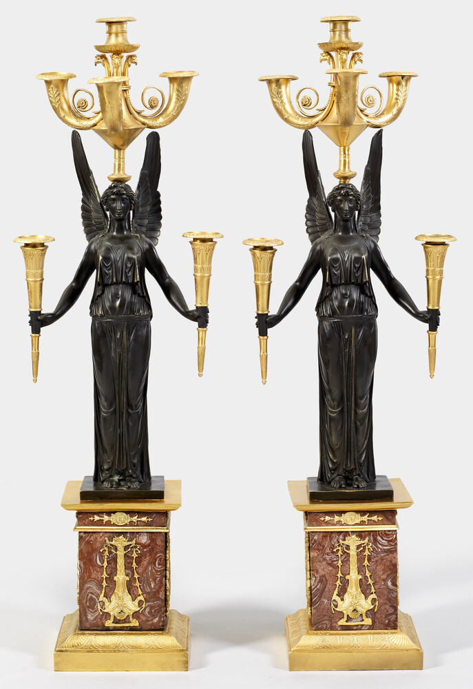 A pair of large French bronze and marble Empire style candelabras