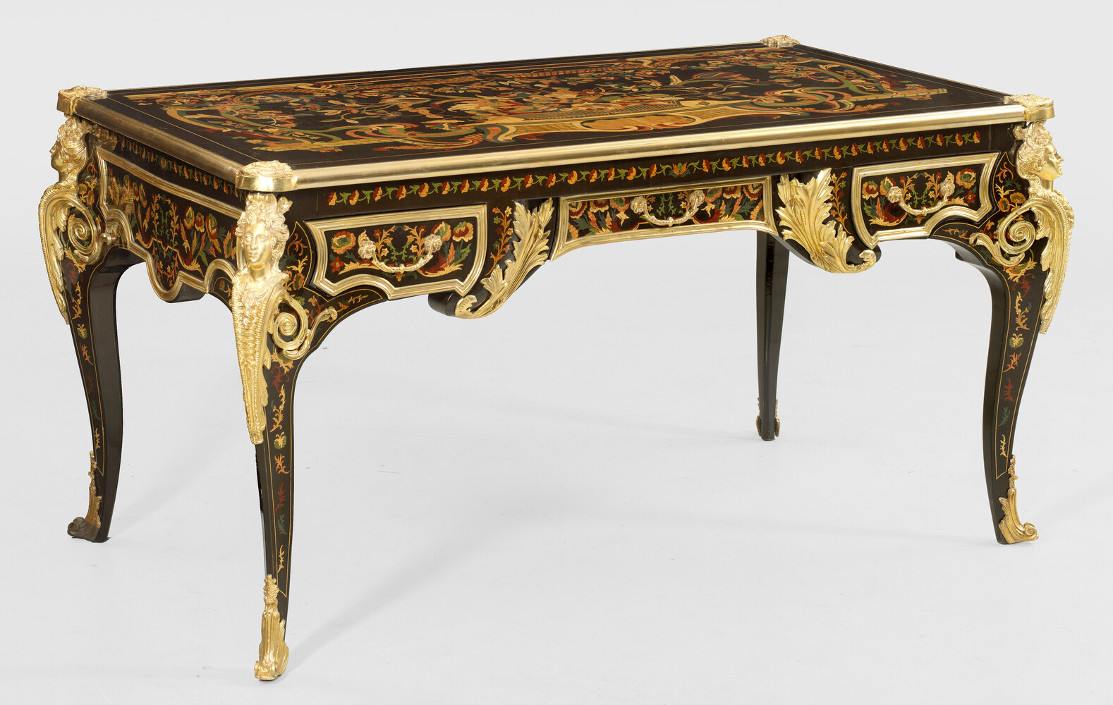 A representative French Louis XV Style bureau plat rich marquetey