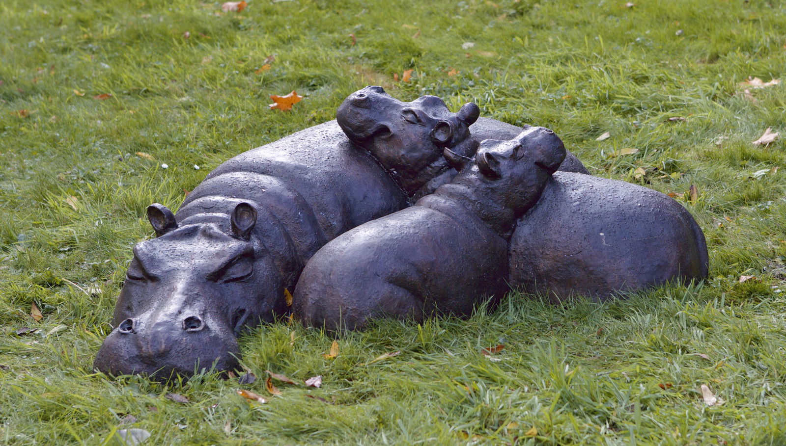 Bronze sculpture of a hippo family