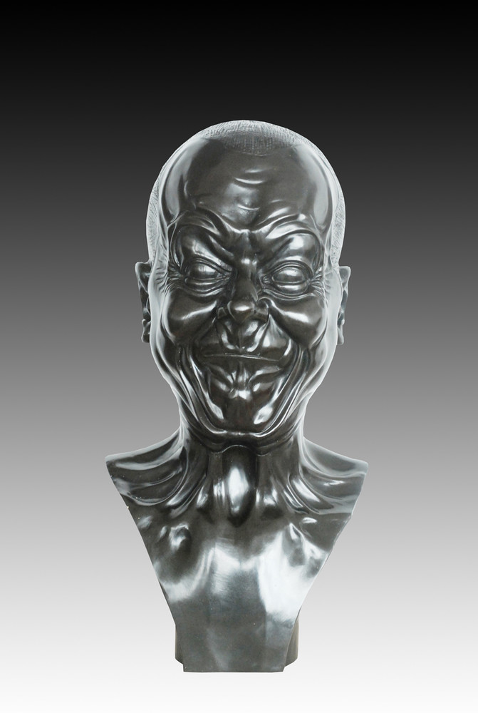 Bronze statue of a mans head 